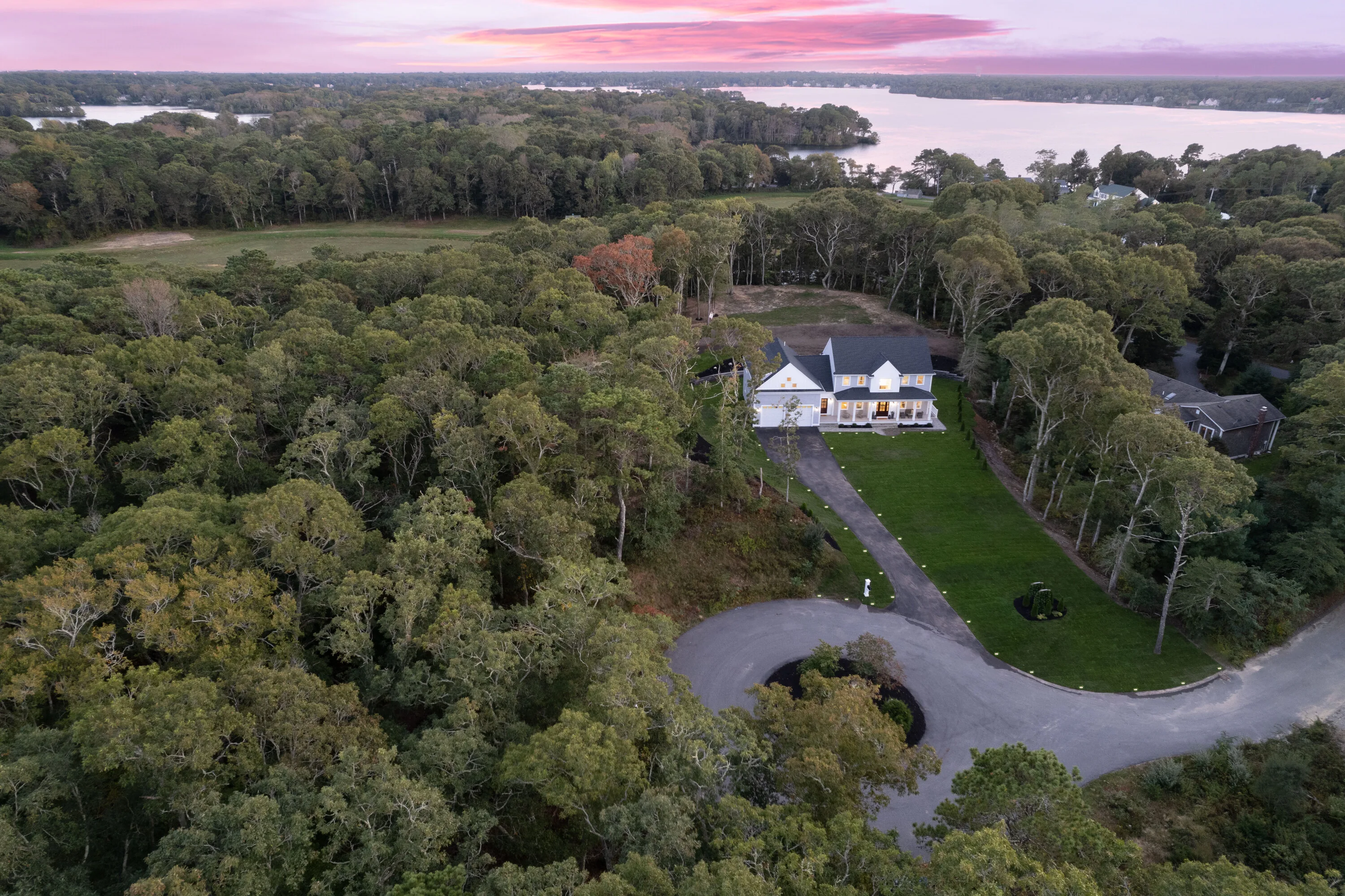 Aerial view of Lakewind House on its secluded wooded acre in Centerville, Cape Cod