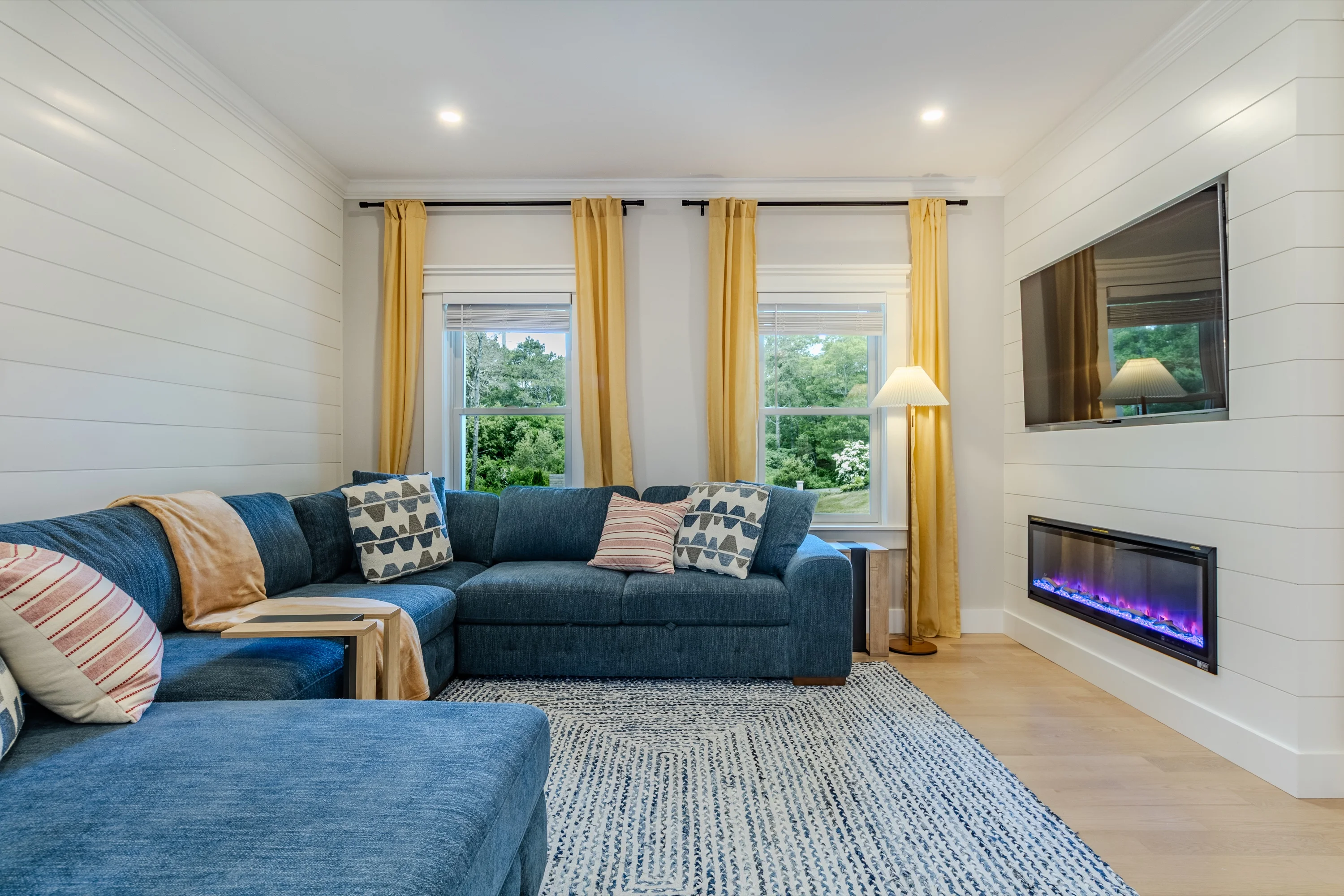 Family room with sectional & electric fireplace