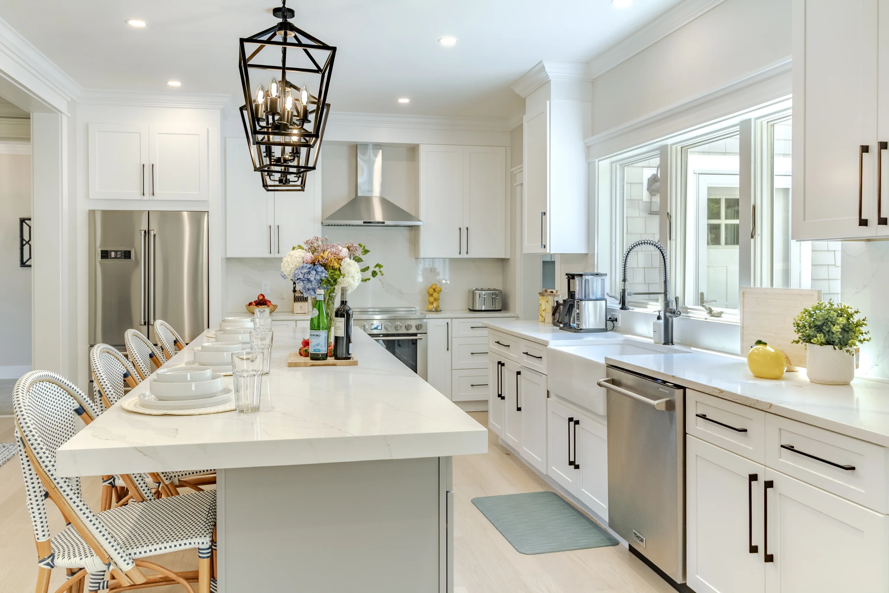 Chef’s kitchen with island and lantern pendants